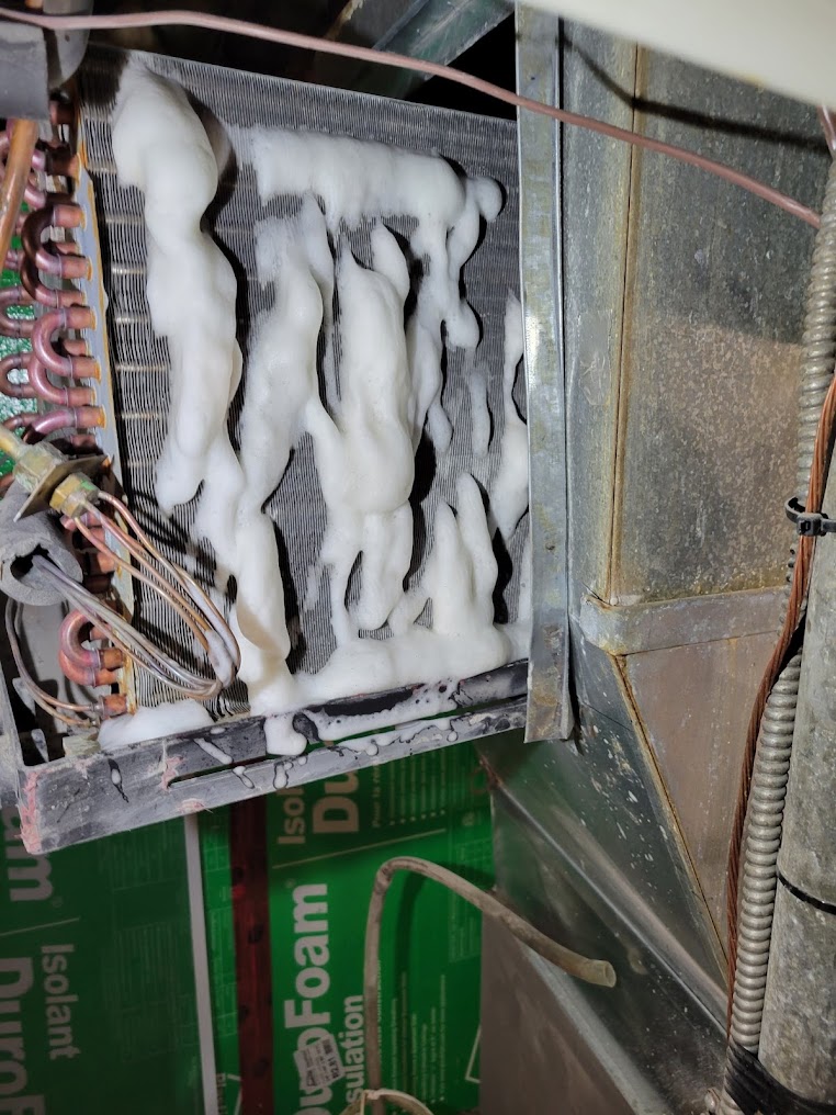 Frozen indoor air conditioning coil requiring HVAC repair